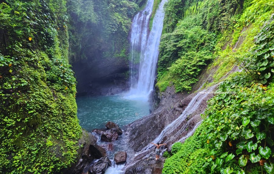 Aling-Aling Waterfall in Bali surrounded by tropical cliffs and lush jungle
